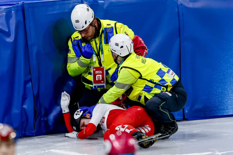 Close-Up Horror: A tight camera angle shows a Polish speed skater being stretchered out of her Olympic race after an opponent’s blade cut beneath her eye