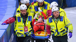 On-Ice Scare: Tight-angle video reveals the Polish speed skater being taken away from the Olympic race after suffering a blade injury beneath her eye